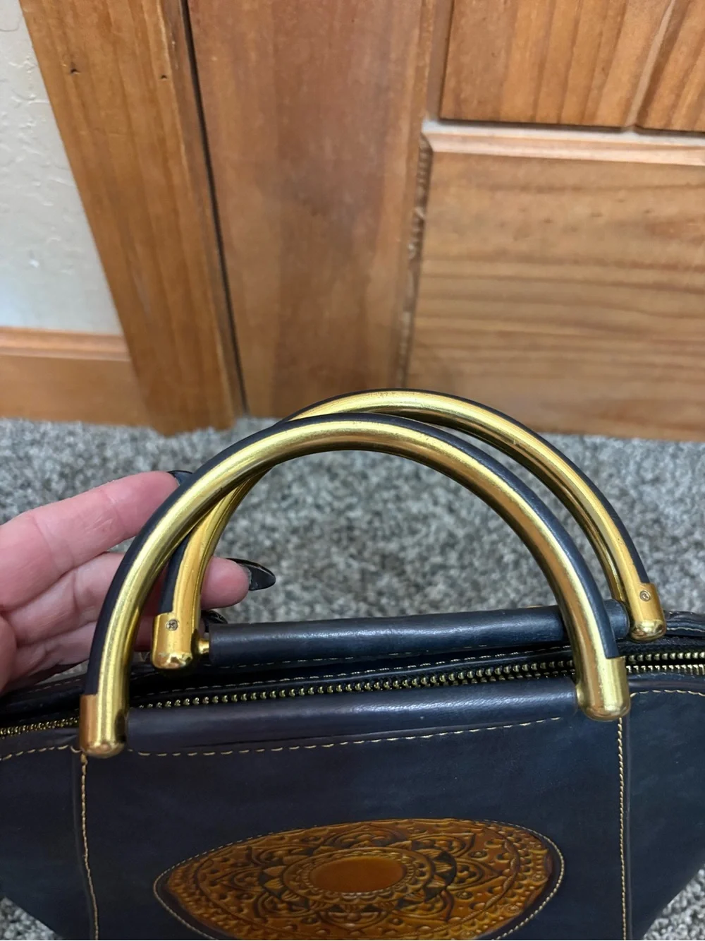 Source Unknown Black Leather Shoulder Bag with Gold Embossed Medallion